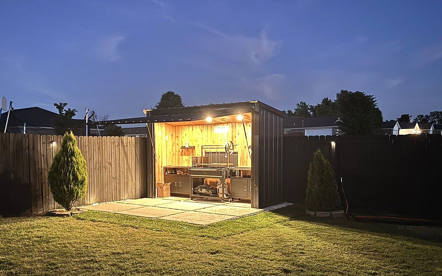 The station lit up at the back of the yard