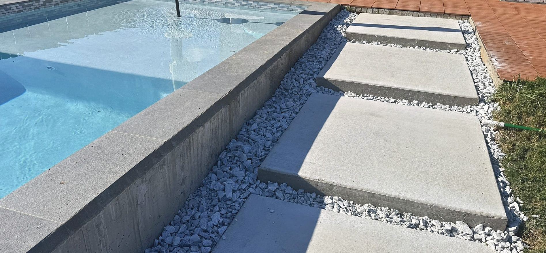 Concrete steps along the pool wall